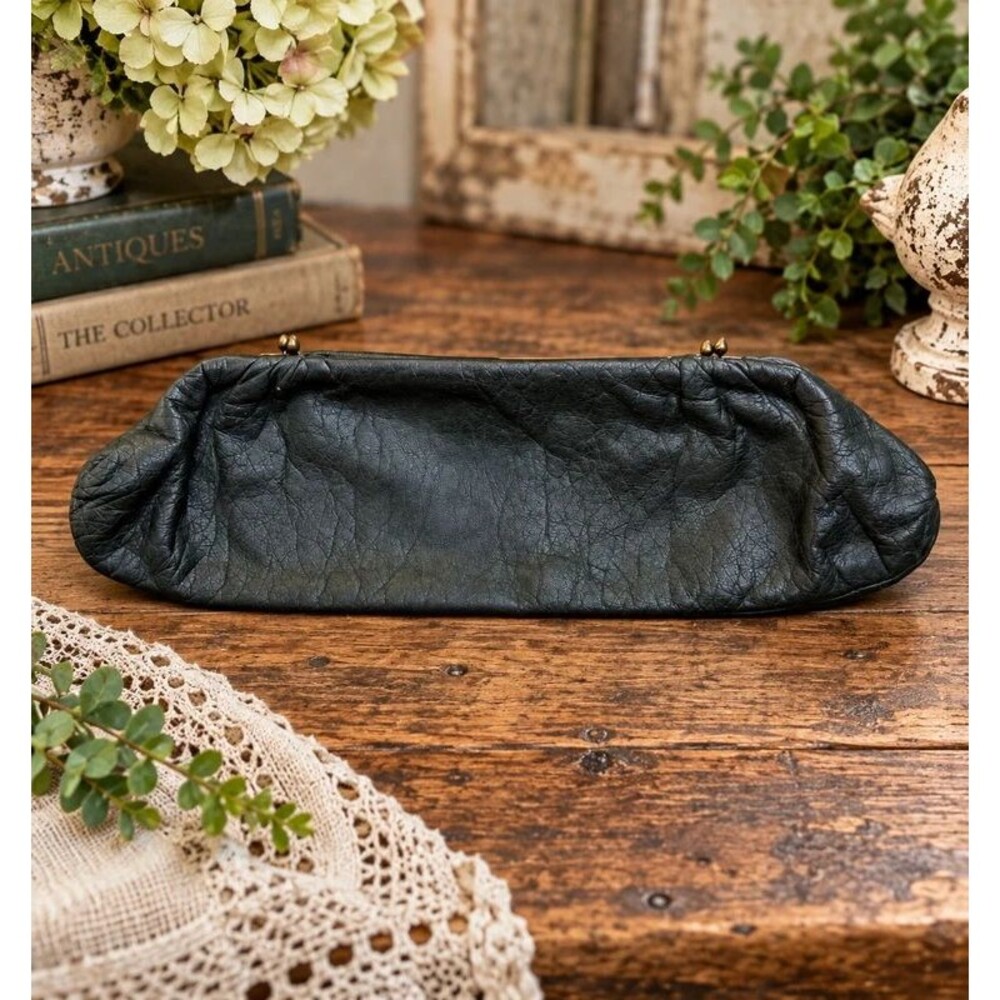 Gorgeous vintage black leather clutch/purse with a classic antique-style brass k